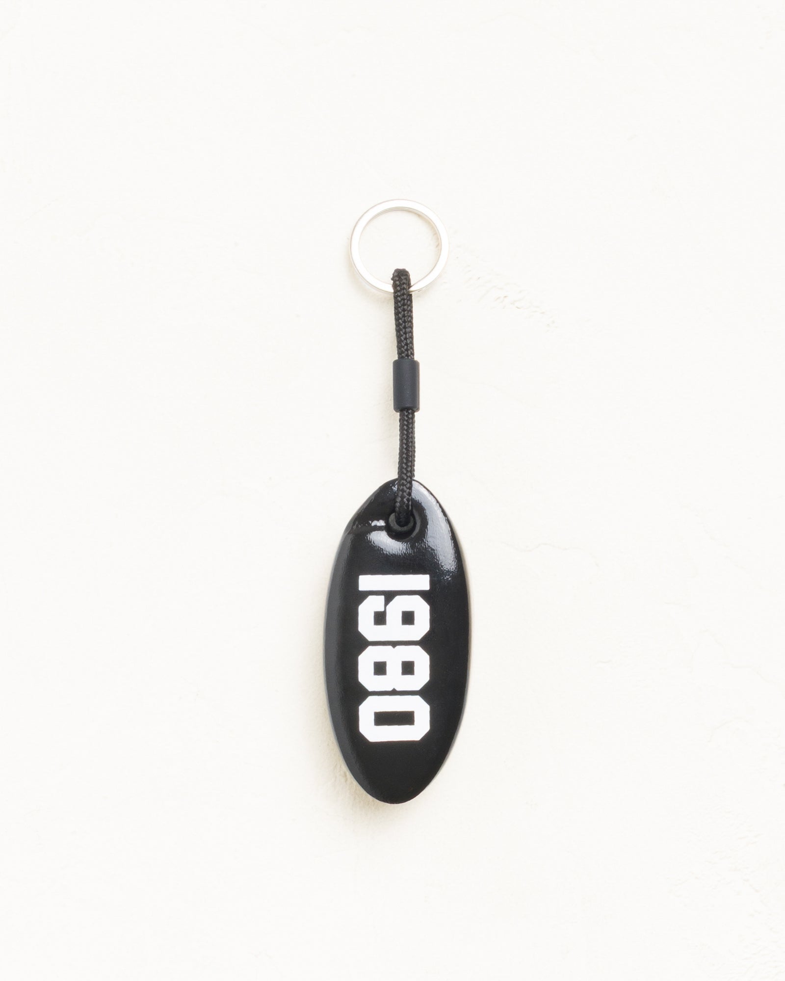 ブラックのビニールコーティングフォーム製Floatie Keychain、1980プリントのアクセサリー